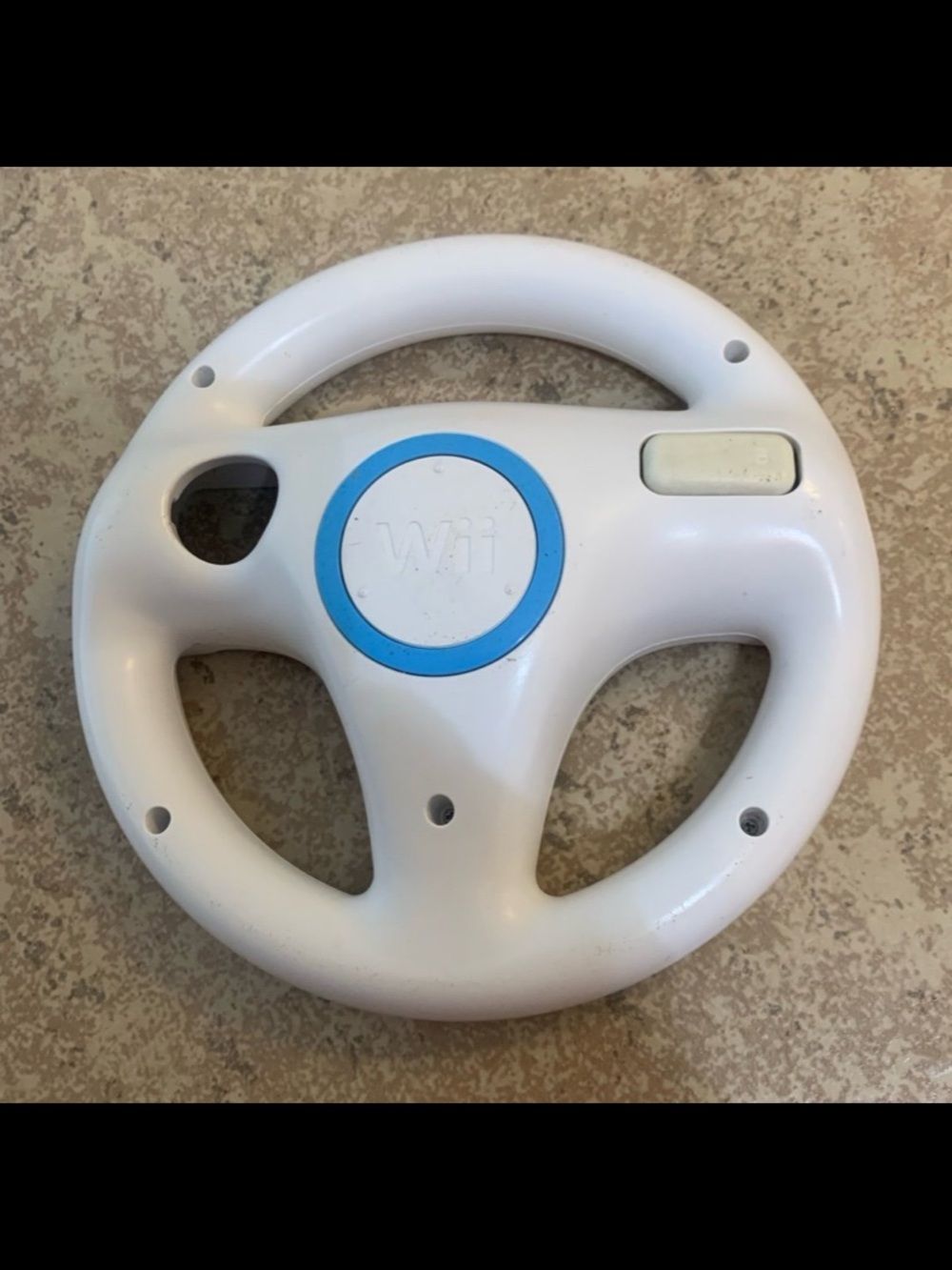 Official Nintendo Wii Steering Wheel (model RVL-024), used for Mario Kart Wii.
